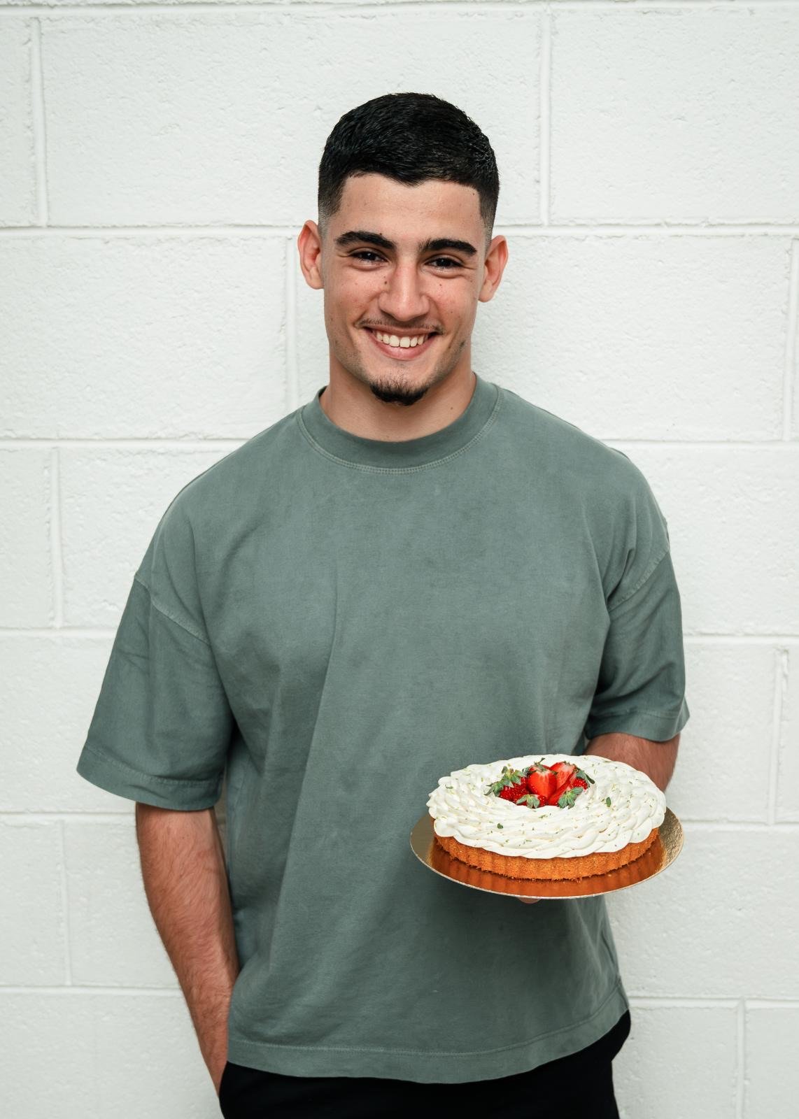 Hands shaping dough on a table